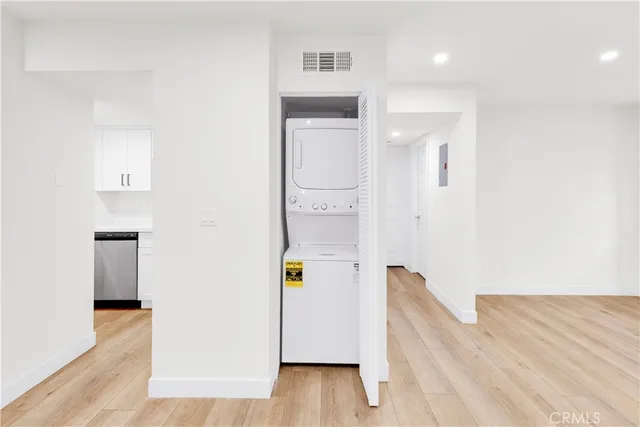 a view of hallway with wooden floor