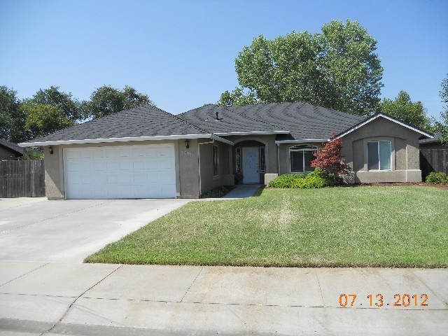 7598 Pit Road Redding, CA 96001 - Photo 1 of 10 a front view of a house with a garden