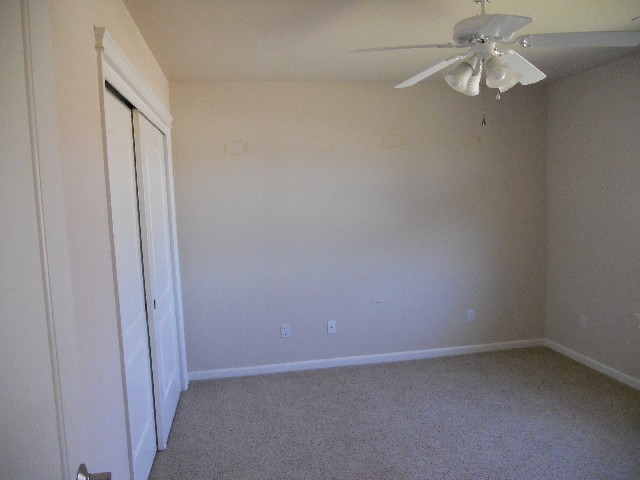 7598 Pit Road Redding, CA 96001 - Photo 8 of 10 a view of an empty room and a chandelier fan