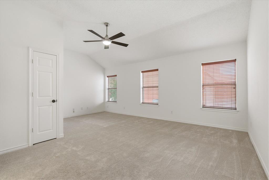 11313 Canoe Road Frisco, TX 75035 - Photo 26 of 40 Primary Bedroom with new carpet offers a sitting area.