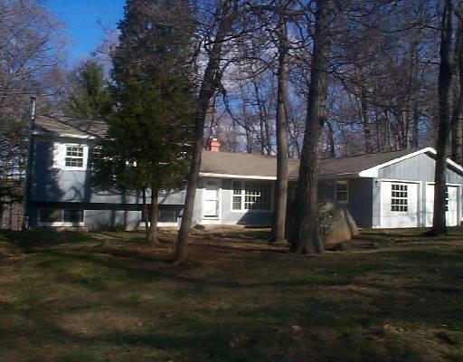 72 Spire View Road Ridgefield, CT 06877 - Photo 1 of 1 a front view of a house with a yard