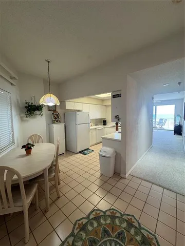 a dining room with a table and chairs