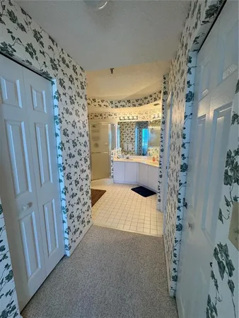 a bathroom with a shower curtain and window