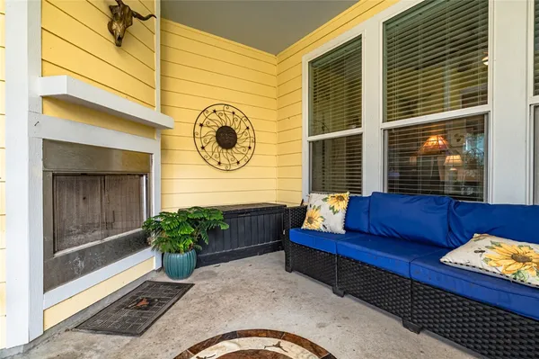 a view of a chairs and table in the patio