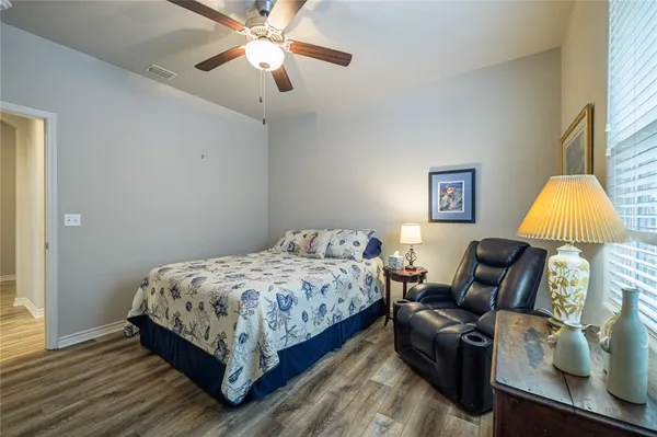 a bedroom with bed and a window