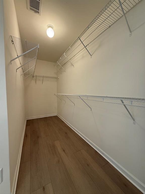 4273 Winslow Hill Court Suwanee, GA 30024 - Photo 22 of 34 a view of a room with racks on the wall