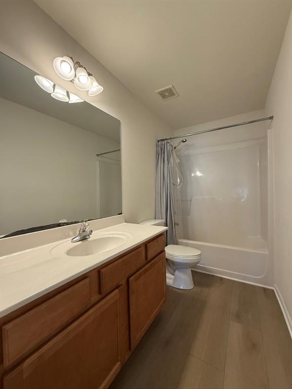 4273 Winslow Hill Court Suwanee, GA 30024 - Photo 28 of 34 a bathroom with a granite countertop sink a toilet and a mirror