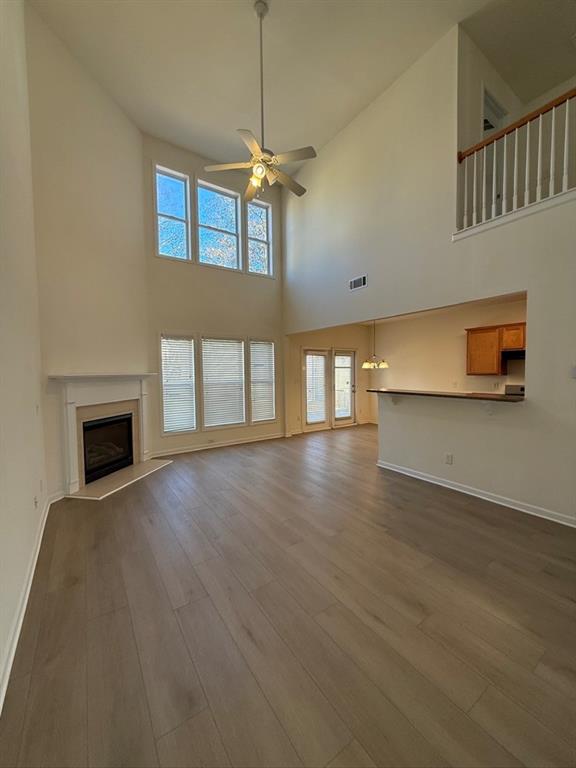 4273 Winslow Hill Court Suwanee, GA 30024 - Photo 7 of 34 a view of empty room with wooden floor and fireplace