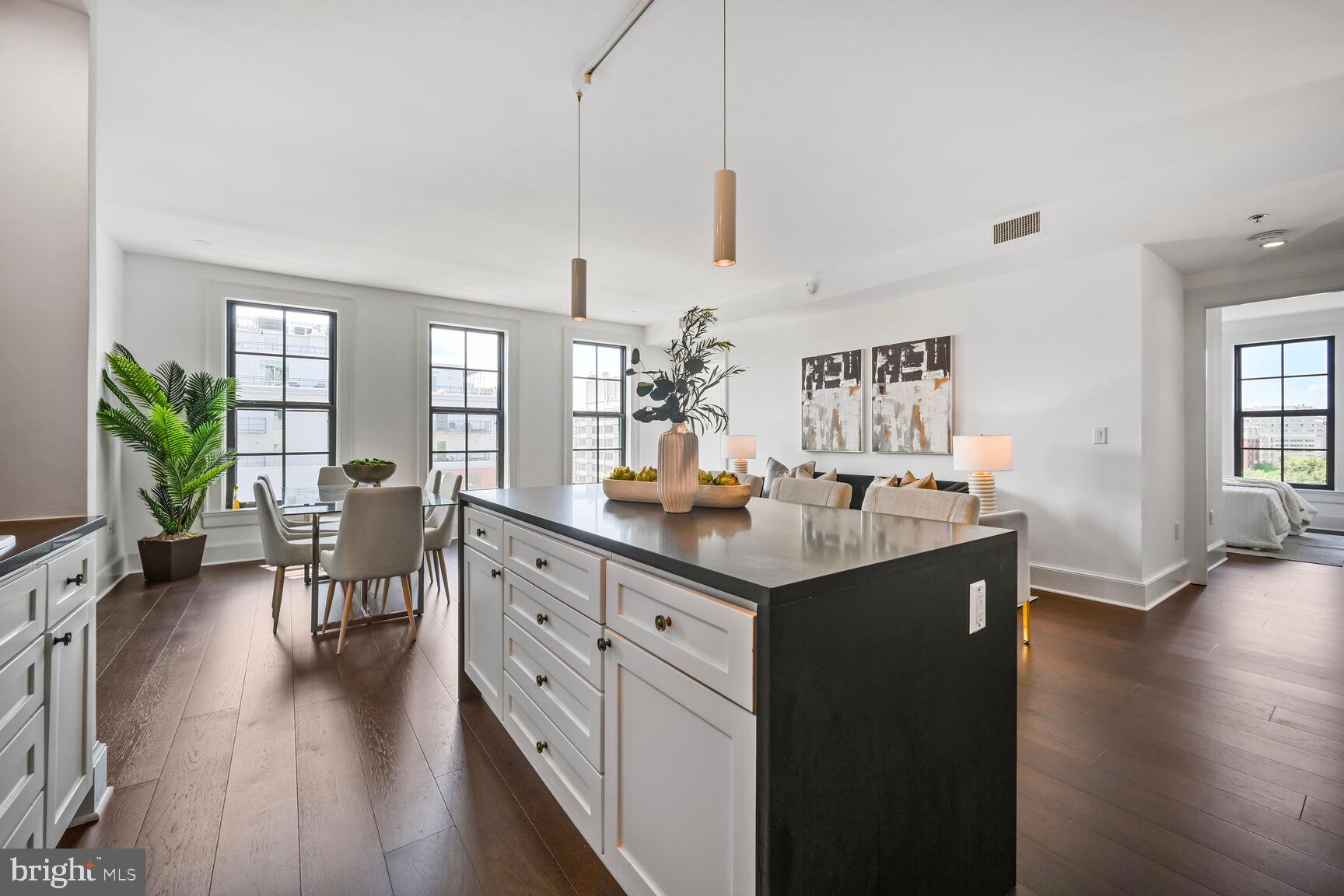 1011 M Street Northwest, Unit 702 Washington, DC 20001 - Photo 19 of 61 a kitchen with counter top space and wooden floor