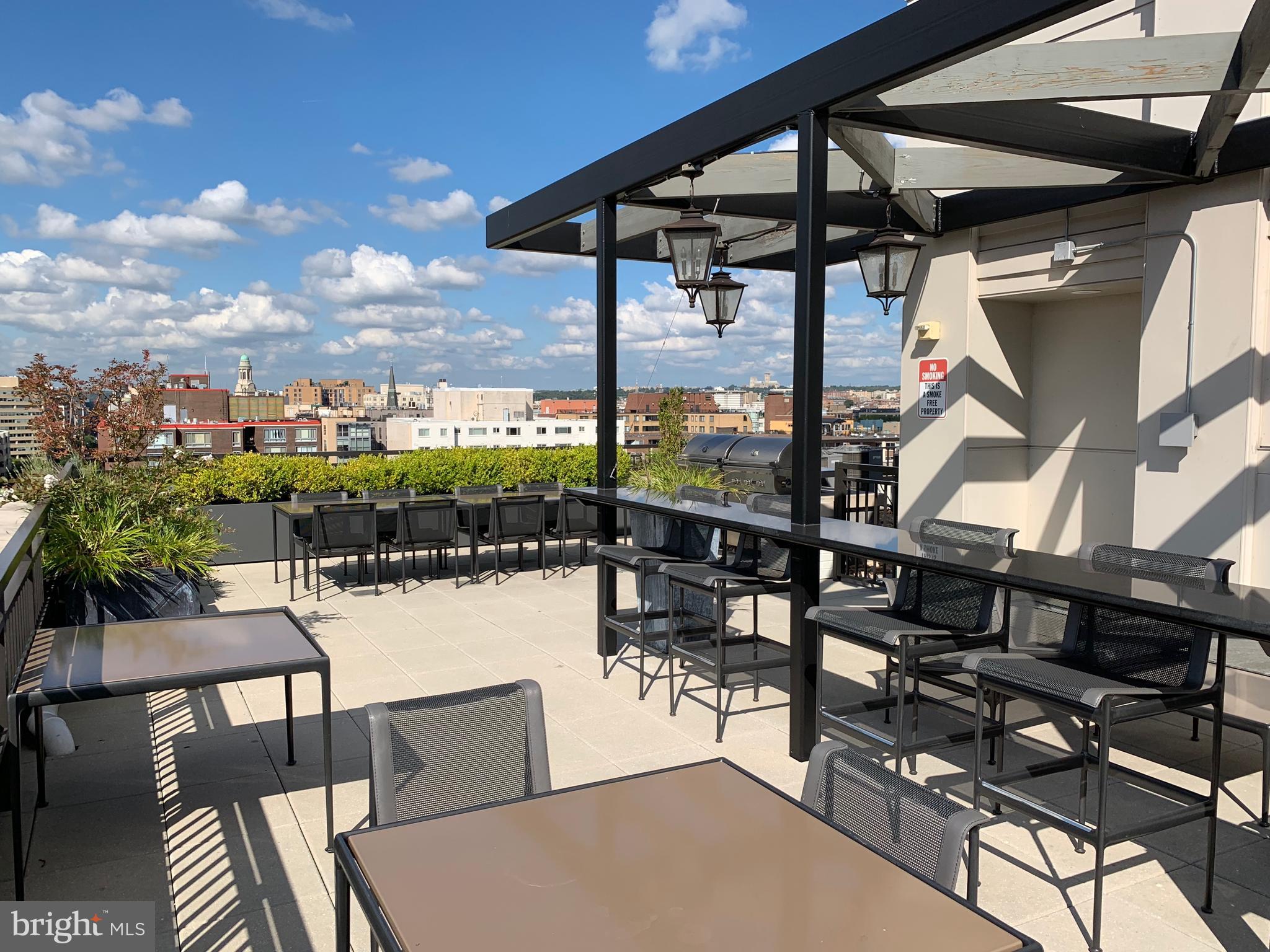 1011 M Street Northwest, Unit 702 Washington, DC 20001 - Photo 28 of 61 a view of a chairs and table in patio
