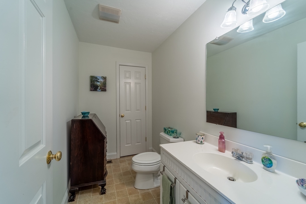 17 Village Way, Unit 17 Rutland, MA 01543 - Photo 13 of 33 a bathroom with a sink vanity mirror and toilet