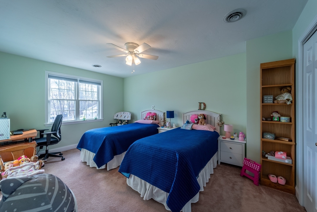 17 Village Way, Unit 17 Rutland, MA 01543 - Photo 14 of 33 a bedroom with two beds and a window