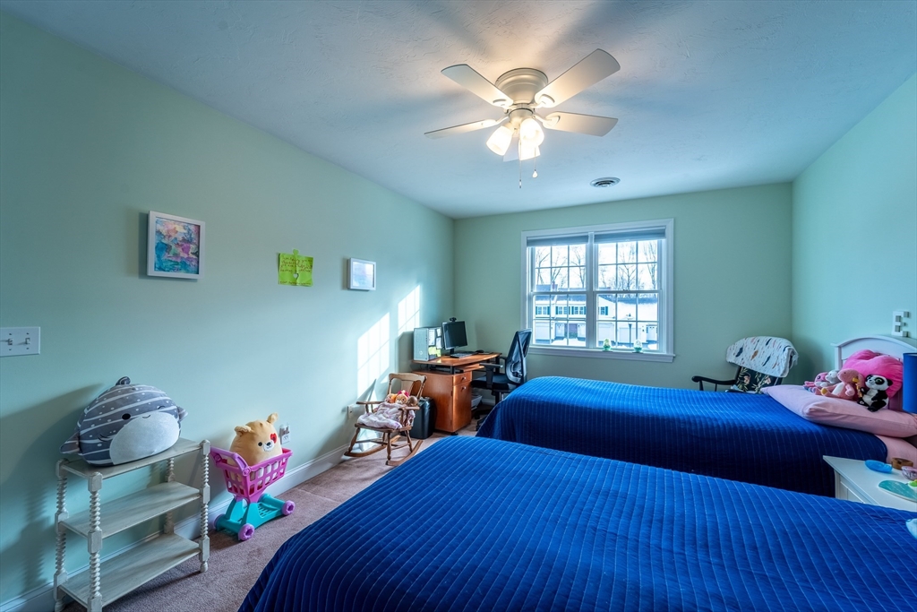 17 Village Way, Unit 17 Rutland, MA 01543 - Photo 16 of 33 a bedroom with a bed and window