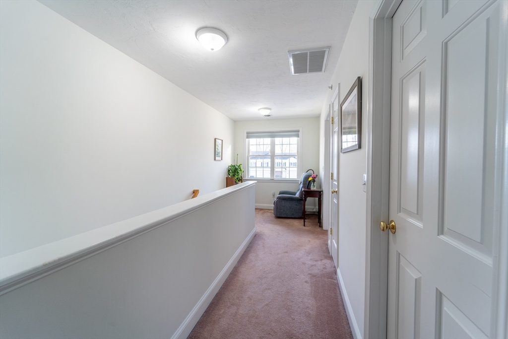 17 Village Way, Unit 17 Rutland, MA 01543 - Photo 23 of 33 a view of a room with wooden floor and windows