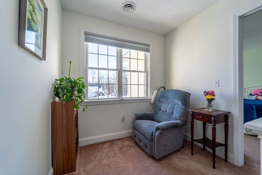 17 Village Way, Unit 17 Rutland, MA 01543 - Photo 24 of 33 a living room with furniture and a window
