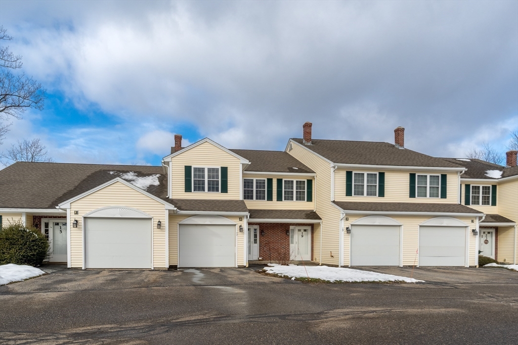 17 Village Way, Unit 17 Rutland, MA 01543 - Photo 32 of 33 a front view of a house with a garage