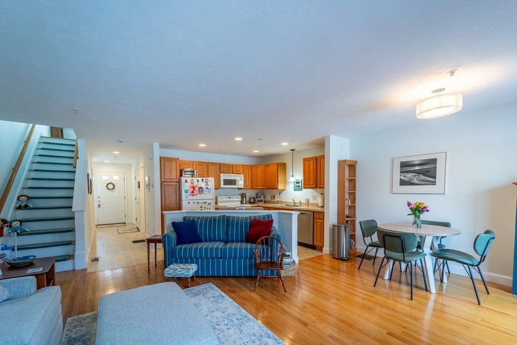 17 Village Way, Unit 17 Rutland, MA 01543 - Photo 6 of 33 a living room with dining room and wooden floor