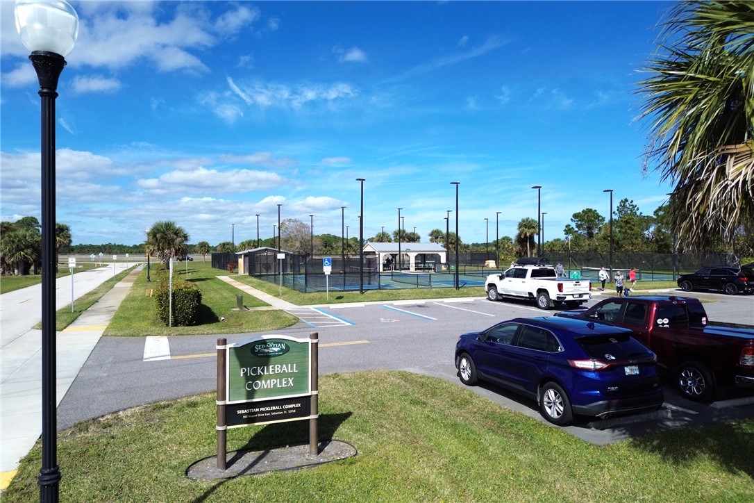 106 Tracy Drive Sebastian, FL 32958 - Photo 23 of 35 a swimming pool with some trees in the background