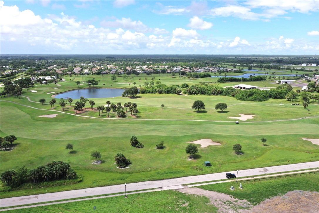 106 Tracy Drive Sebastian, FL 32958 - Photo 26 of 35 a view of a golf course with a lake