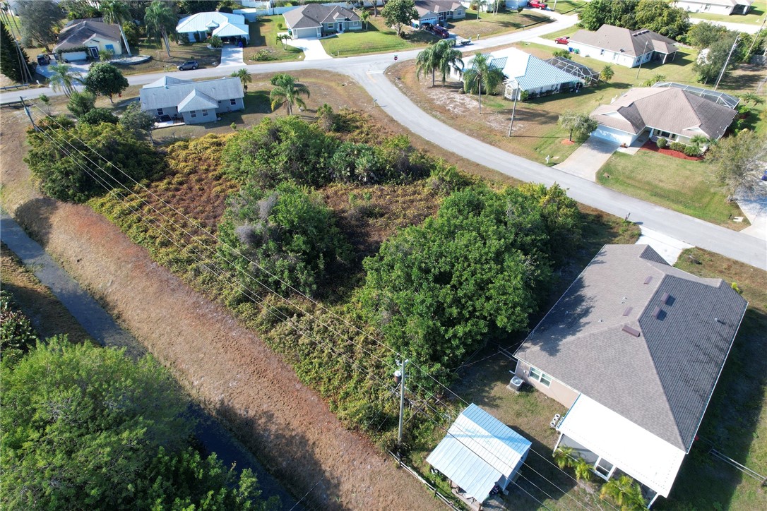 106 Tracy Drive Sebastian, FL 32958 - Photo 8 of 35 an aerial view of a house with a yard and lake view