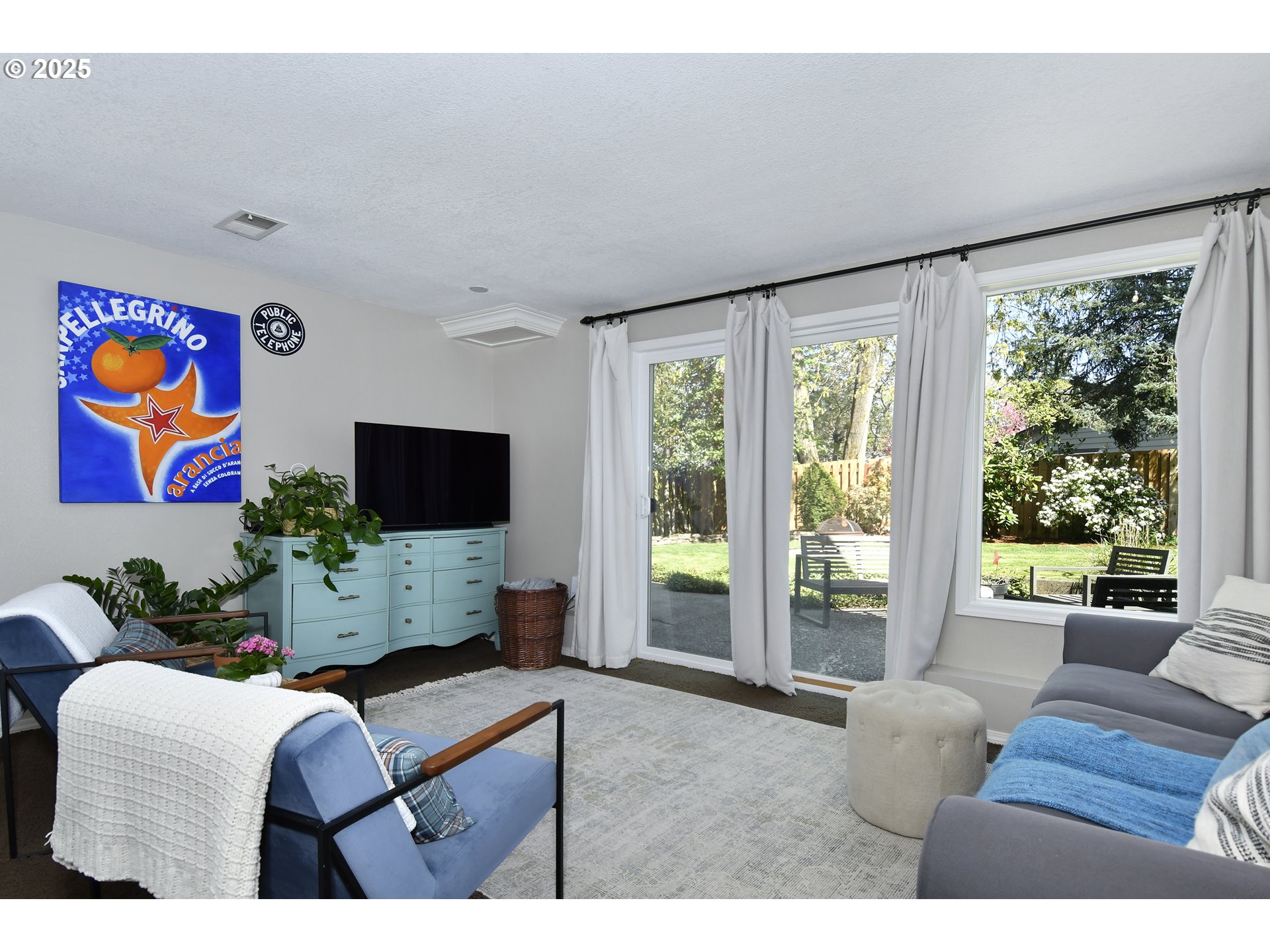 2430 Southwest Willowbrook Avenue Gresham, OR 97080 - Photo 14 of 33 a living room with furniture and a flat screen tv