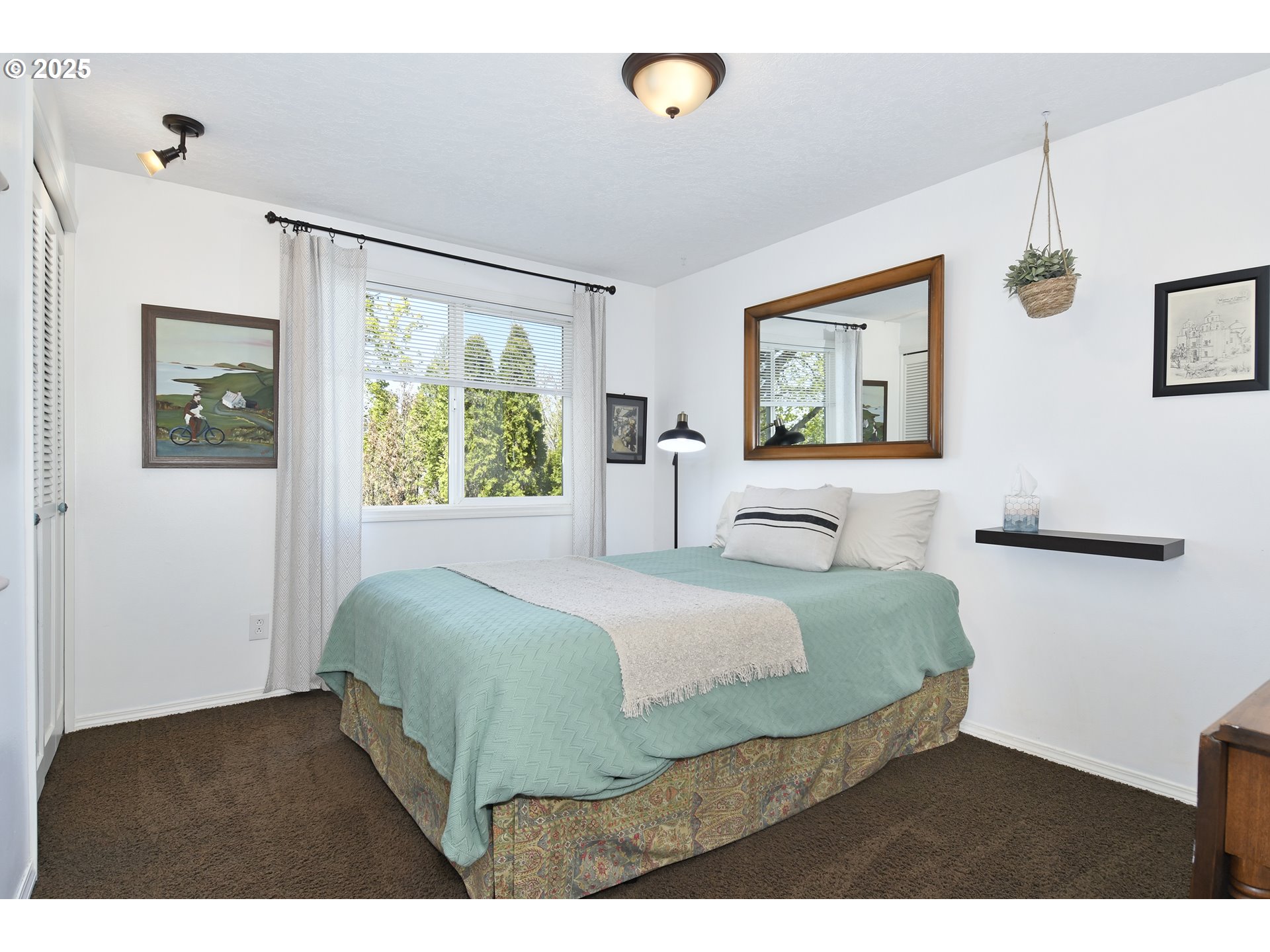 2430 Southwest Willowbrook Avenue Gresham, OR 97080 - Photo 23 of 33 a bedroom with a bed and wooden floor
