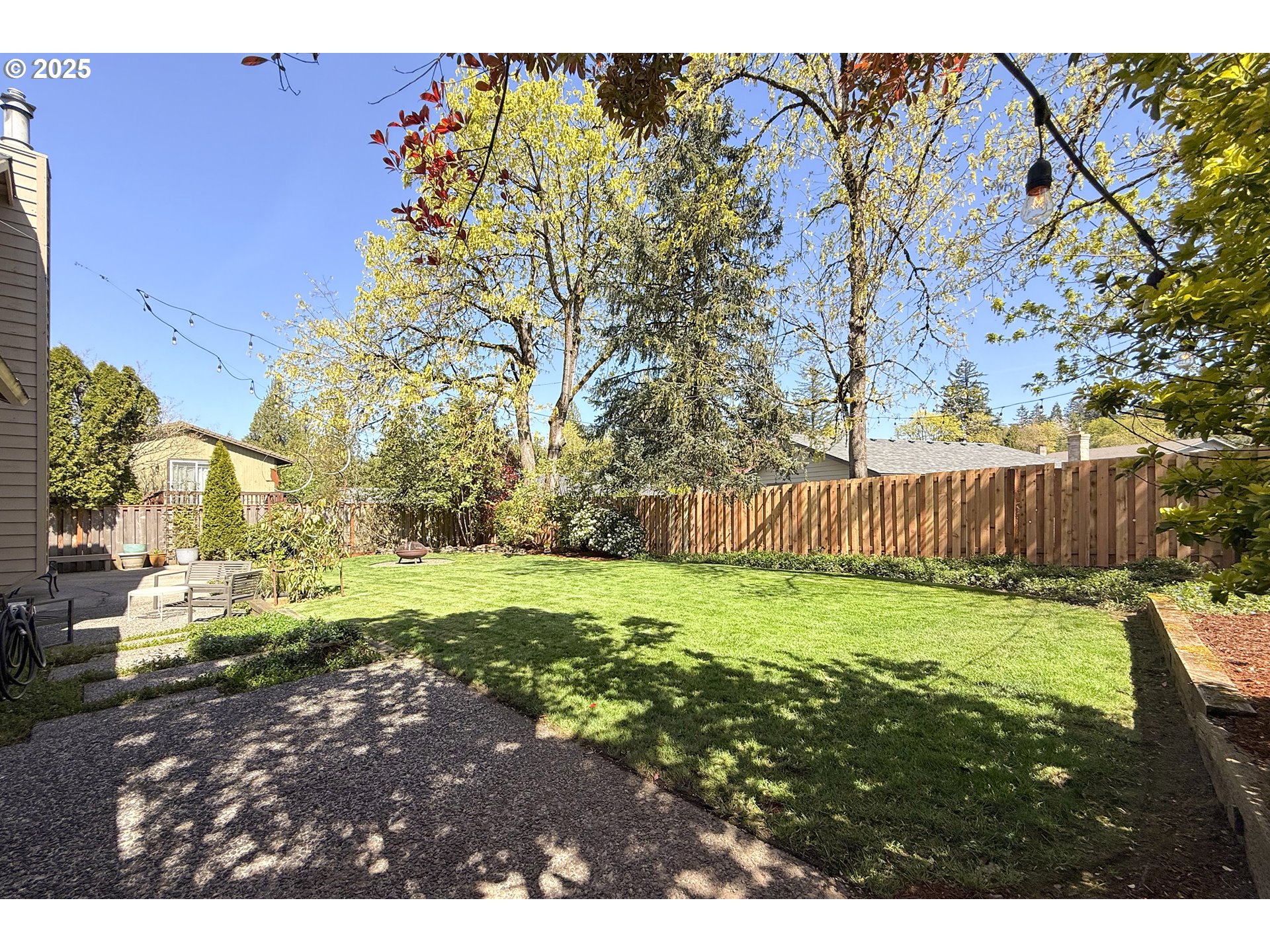 2430 Southwest Willowbrook Avenue Gresham, OR 97080 - Photo 29 of 33 a backyard of a house with lots of green space