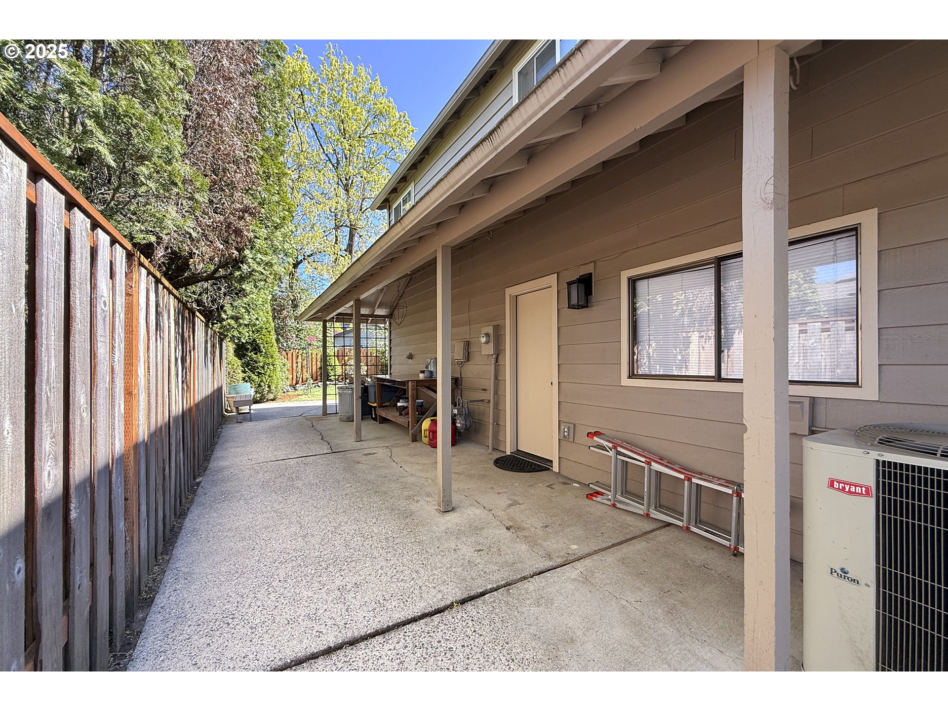 2430 Southwest Willowbrook Avenue Gresham, OR 97080 - Photo 33 of 33 a view of a house with a patio and wooden fence