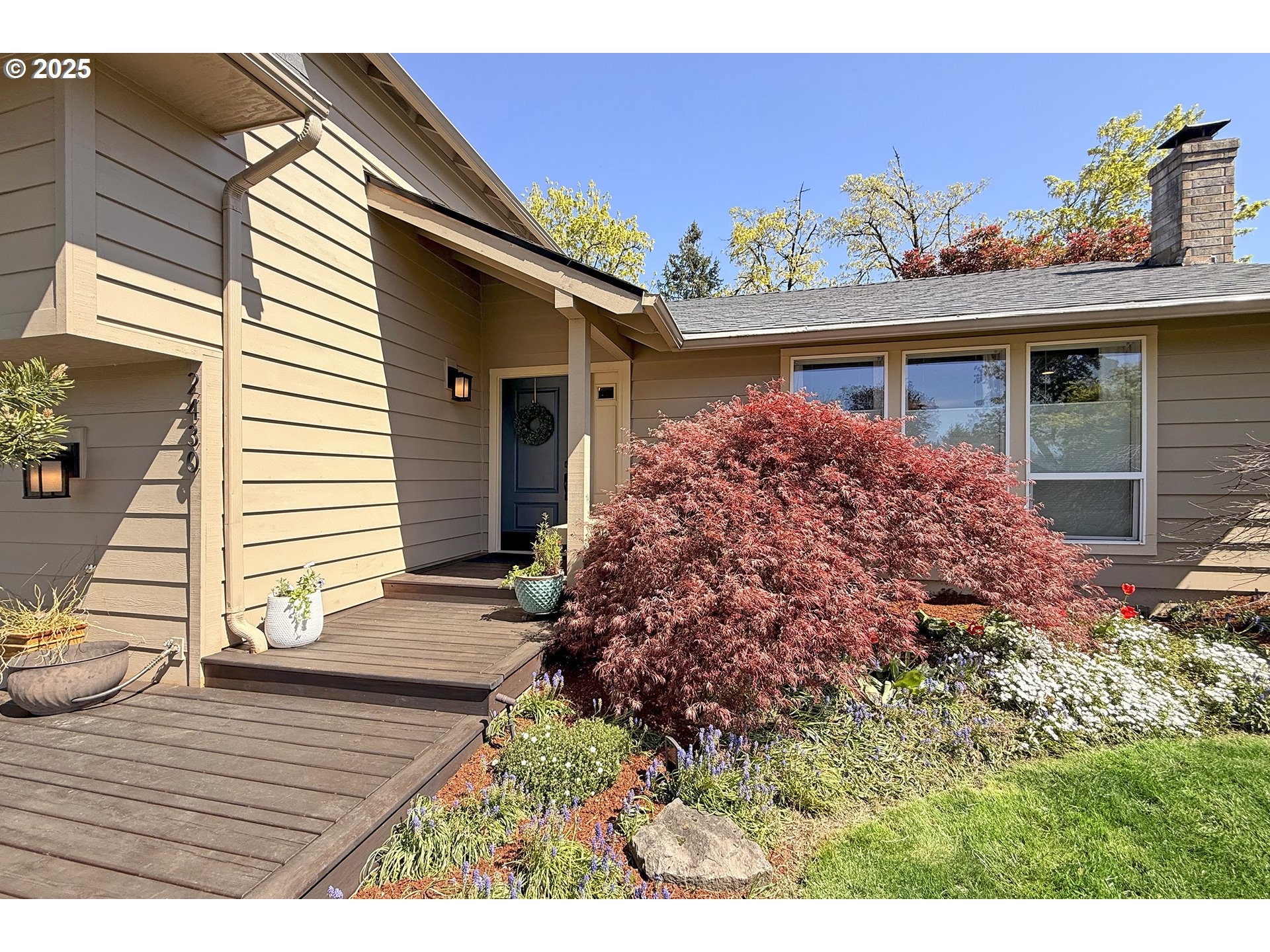 2430 Southwest Willowbrook Avenue Gresham, OR 97080 - Photo 4 of 33 a front view of a house with a porch