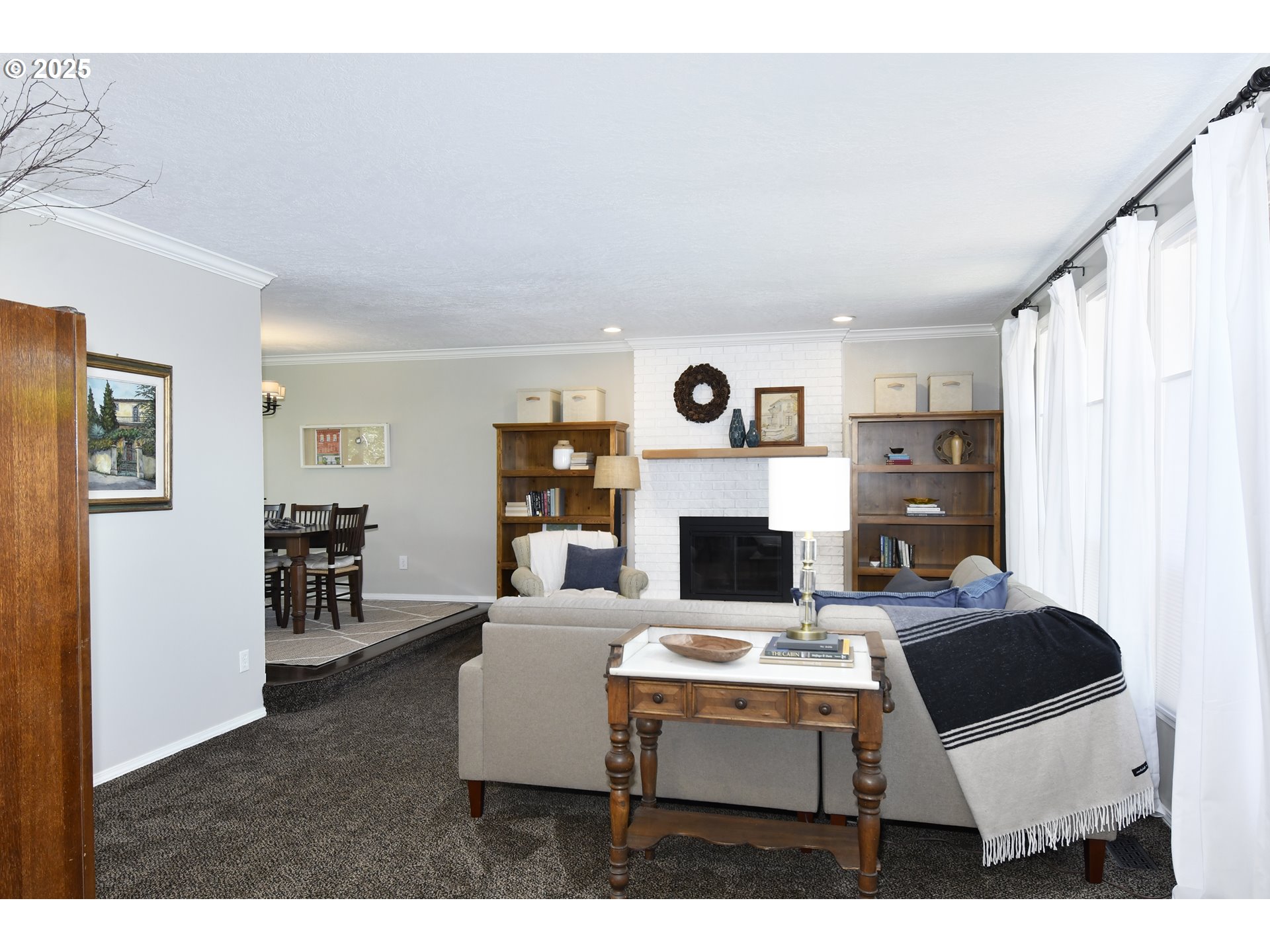 2430 Southwest Willowbrook Avenue Gresham, OR 97080 - Photo 6 of 33 a living room with furniture a table and a fireplace