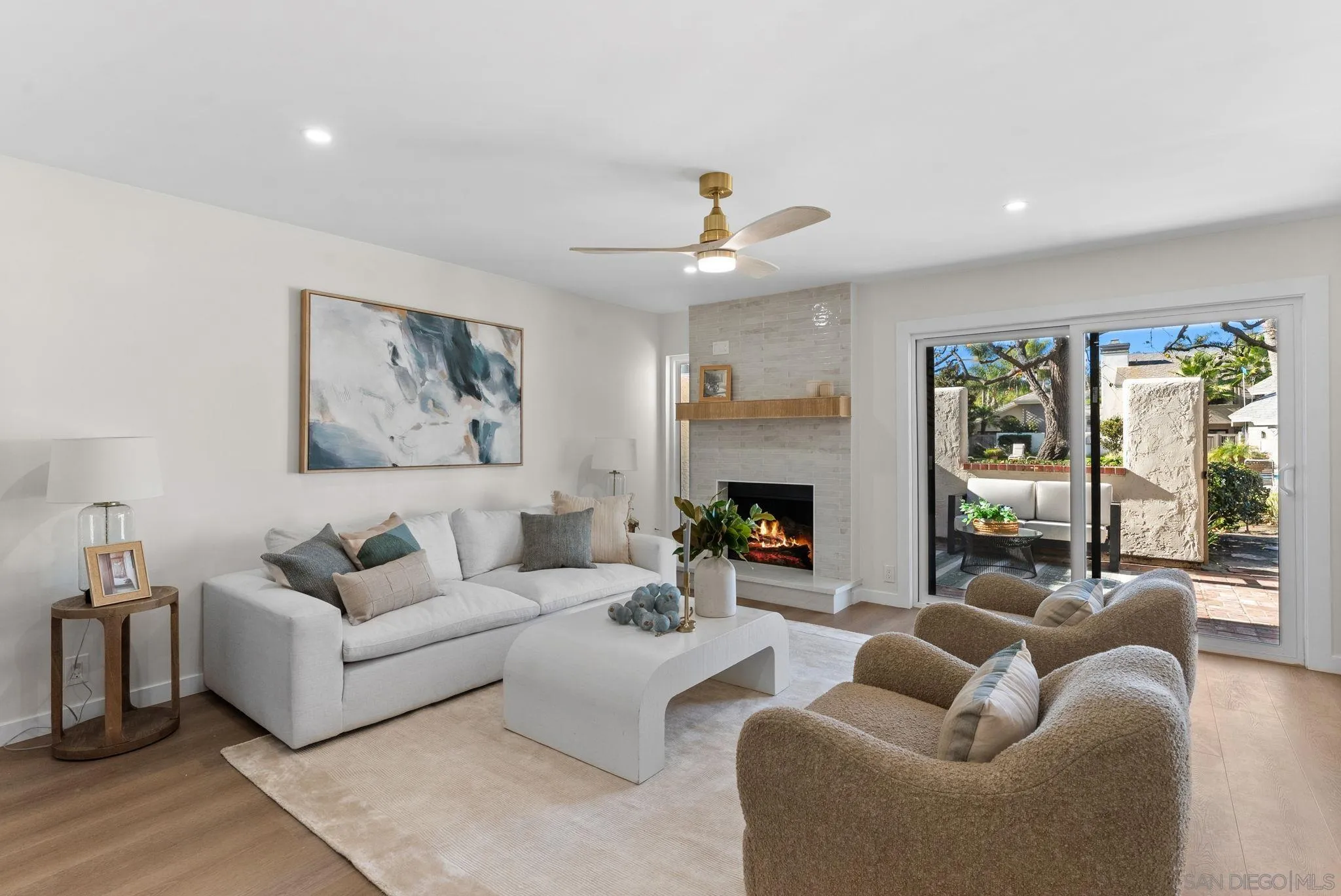 16048 Via Viajera Rancho Santa Fe, CA 92091 - Photo 11 of 46 a living room with furniture a fireplace and a large window