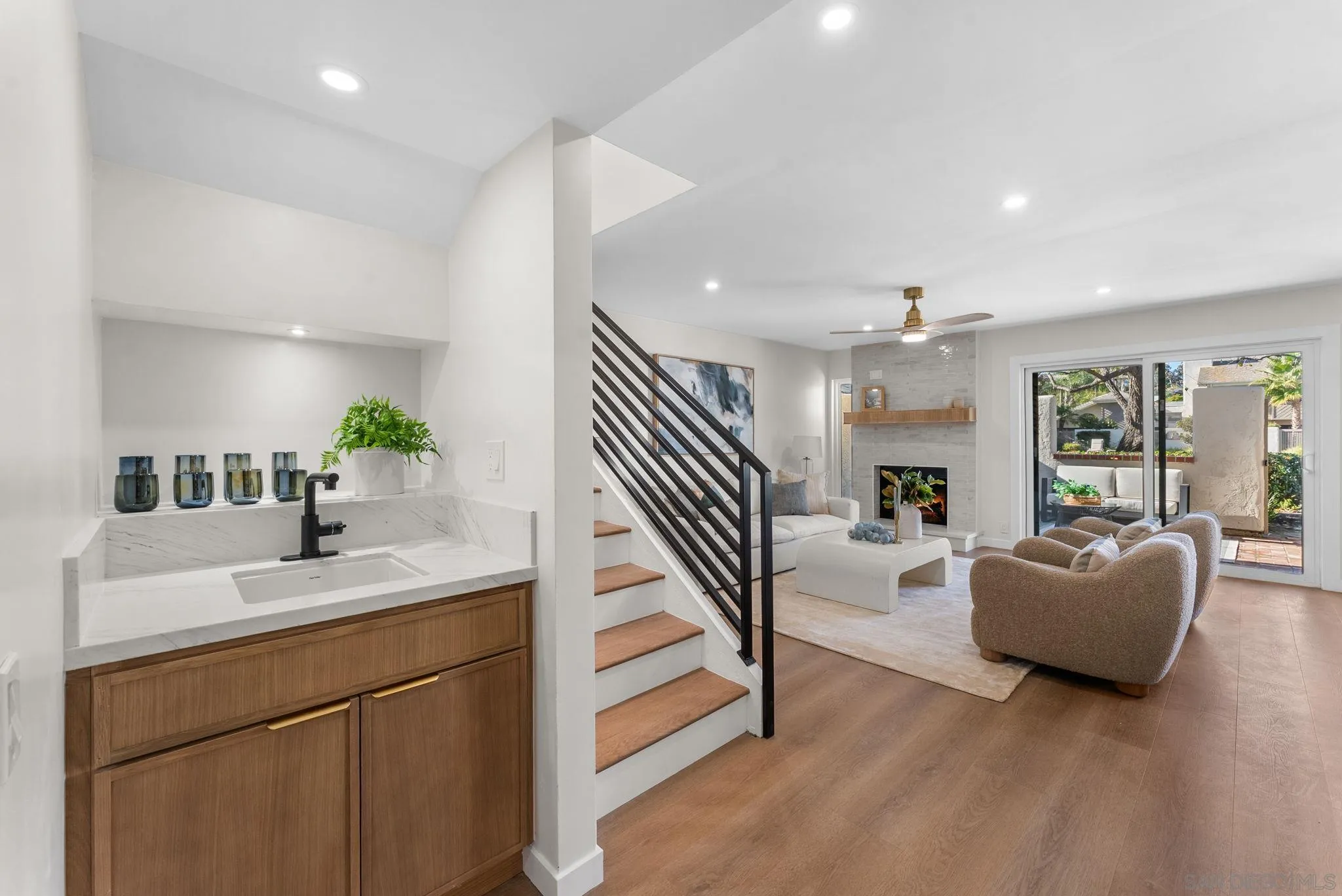 16048 Via Viajera Rancho Santa Fe, CA 92091 - Photo 13 of 46 a living room with furniture and a kitchen