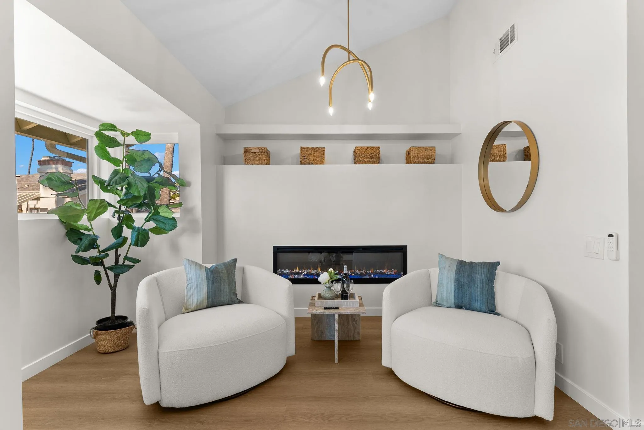 16048 Via Viajera Rancho Santa Fe, CA 92091 - Photo 21 of 46 a living room with furniture a potted plant and a fireplace