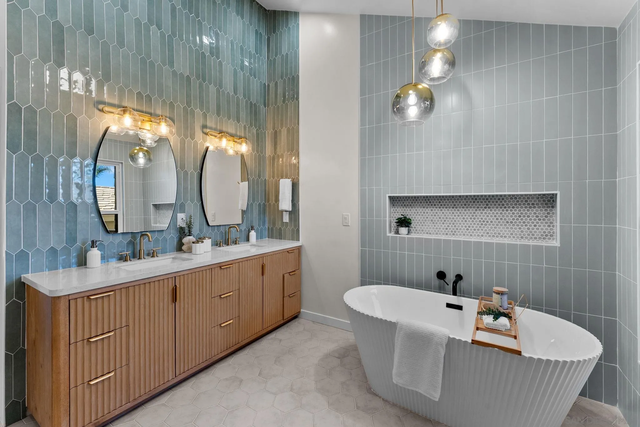 16048 Via Viajera Rancho Santa Fe, CA 92091 - Photo 23 of 46 a bathroom with a bathtub a double vanity sink and mirror
