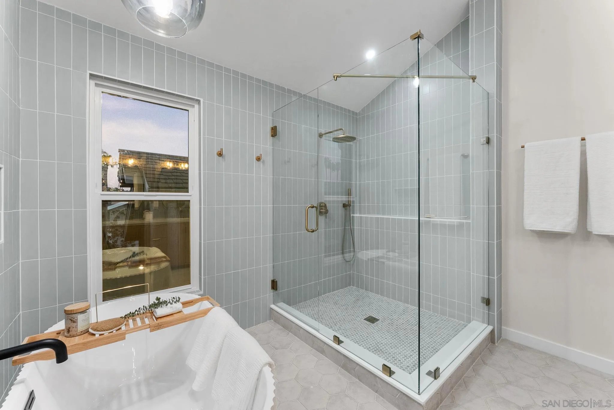 16048 Via Viajera Rancho Santa Fe, CA 92091 - Photo 24 of 46 a bathroom with a shower sink and mirror