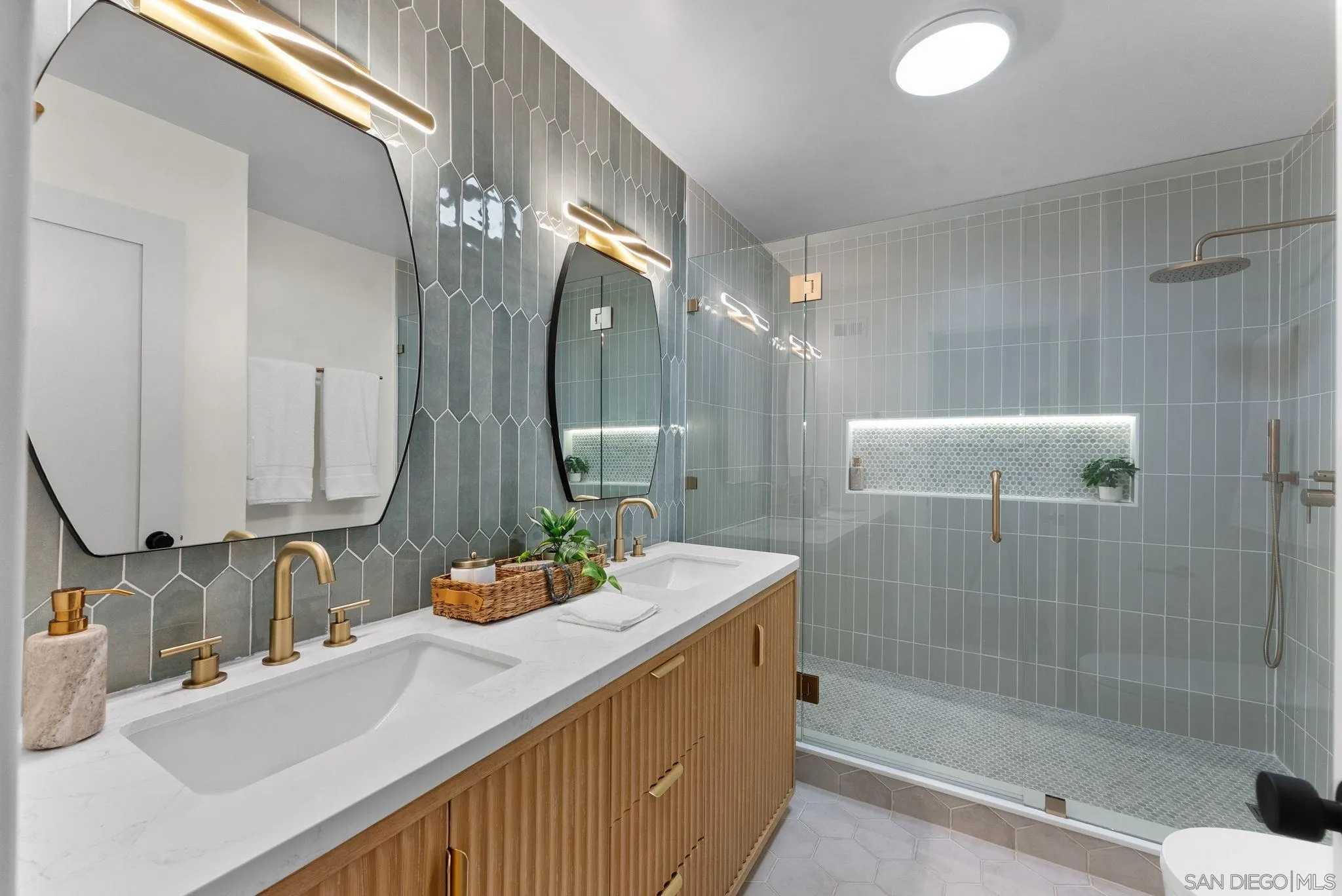 16048 Via Viajera Rancho Santa Fe, CA 92091 - Photo 28 of 46 a bathroom with a sink and a mirror