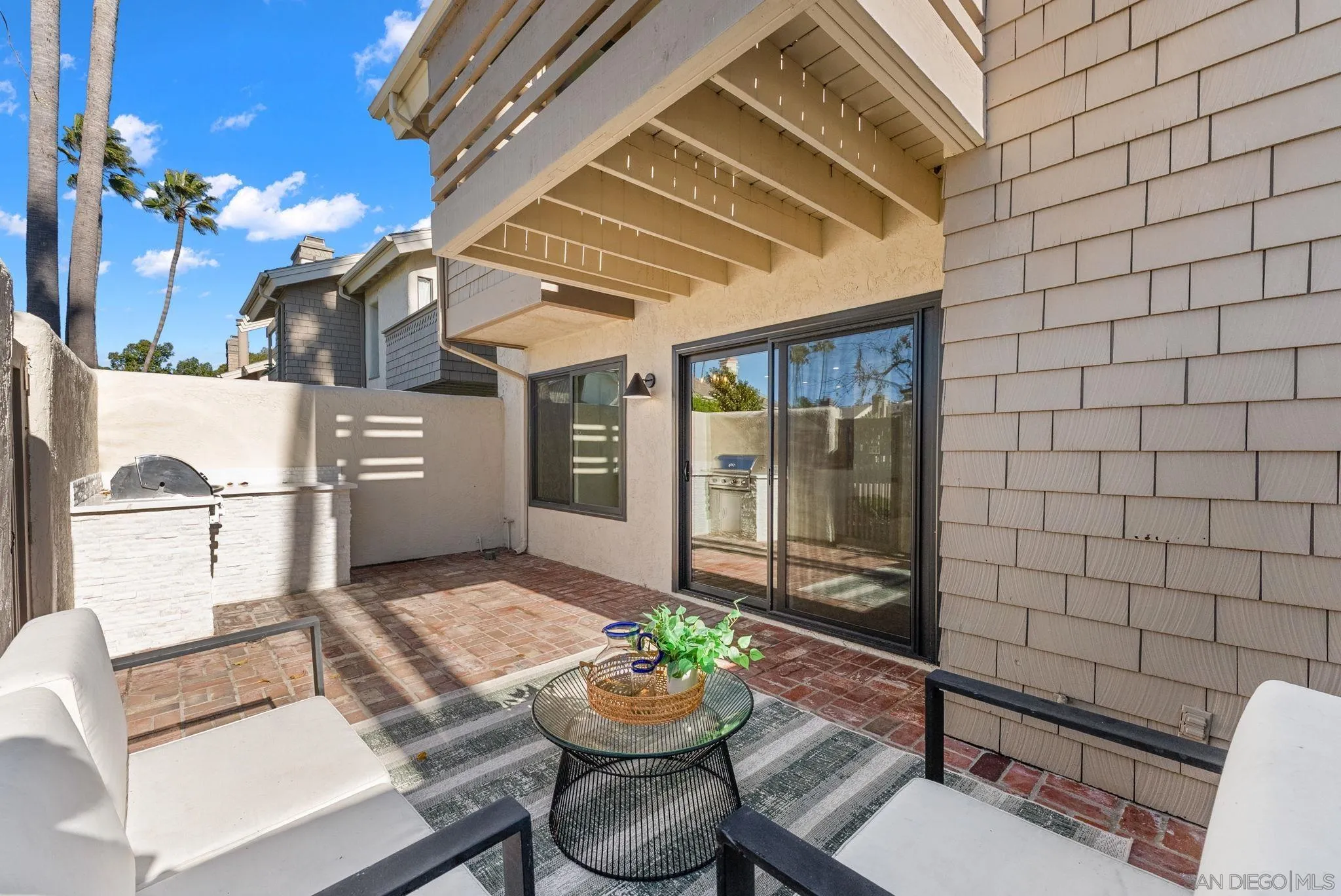 16048 Via Viajera Rancho Santa Fe, CA 92091 - Photo 34 of 46 a view of a patio with couple of chairs and a potted plant