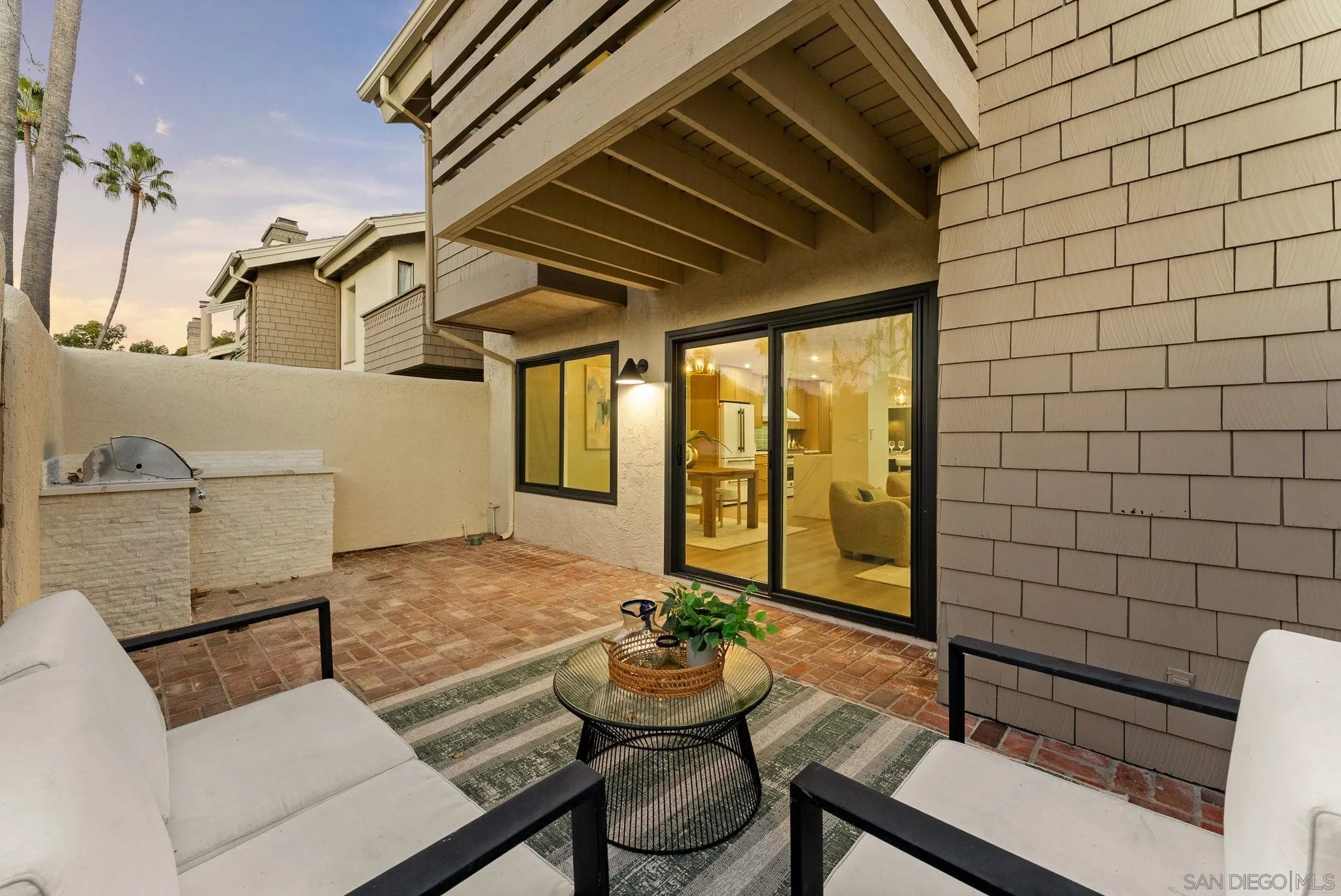 16048 Via Viajera Rancho Santa Fe, CA 92091 - Photo 35 of 46 a view of a patio with couches table and chairs and potted plants