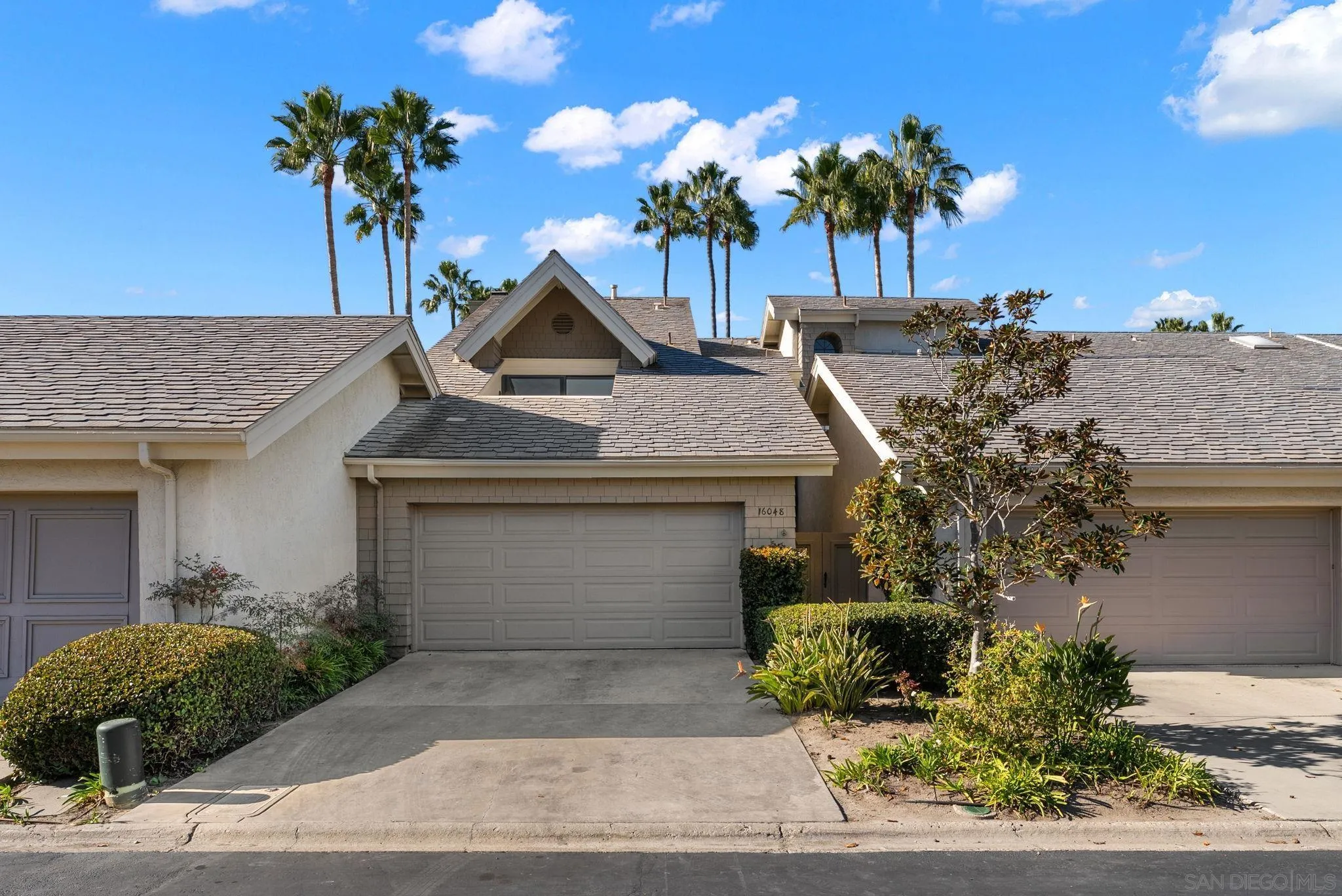 16048 Via Viajera Rancho Santa Fe, CA 92091 - Photo 37 of 46 a front view of a house with a garden