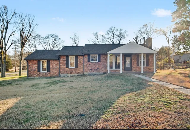 a front view of a house with a yard