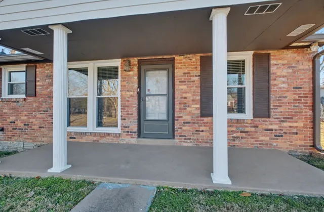 a front view of a house with a porch