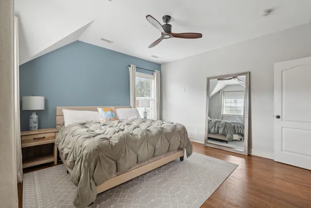 a bed room with a bed and a chandelier