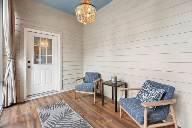 a view of a livingroom with furniture and wooden floor