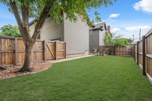 a backyard with potted plants