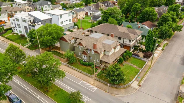 an aerial view of residential houses with outdoor space