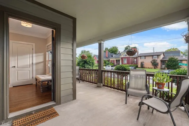 a view of a balcony with furniture