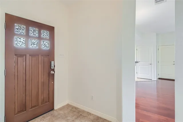 a view of an entryway with wooden floor