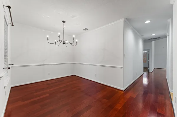 a view of a room with wooden floor