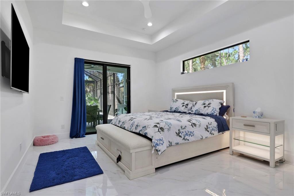491 9th Street Southwest Naples, FL 34117 - Photo 13 of 49 a bedroom with a bed and a window