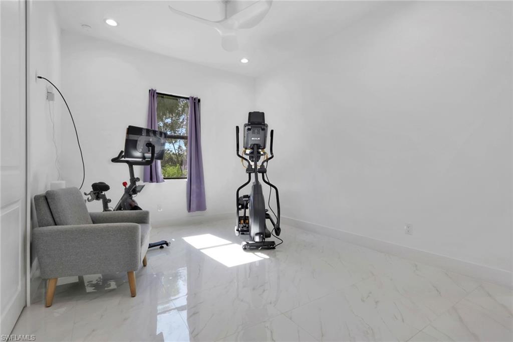 491 9th Street Southwest Naples, FL 34117 - Photo 21 of 49 a living room with furniture and a window